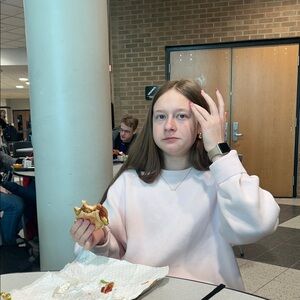 Brunette in a pink sweater